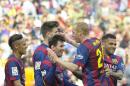 FC Barcelona's Lionel Messi from Argentina, center, reacts after scoring against Valencia during a Spanish La Liga soccer match at the Camp Nou stadium in Barcelona, Spain, Saturday, April 18, 2015. (AP Photo/Manu Fernandez)