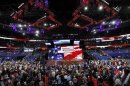 Delegates stand for a prayer and the U.S. national anthem at the start of the second session of the Republican National Convention in Tampa
