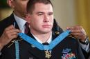 US President Barack Obama awards Sergeant Kyle White the Medal of Honor during a ceremony in the East Room of the White House on May 13, 2014 in Washington