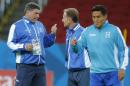 Luis Fernando Suarez, head coach of Honduras' soccer team, left, talks with an assistant during a training session at the Estadio Beira-Rio in Porto Alegre, Brazil, Saturday, June 14, 2014. Honduras will play in E group of the Brazil 2014 World Cup. (AP Photo/David Vincent)