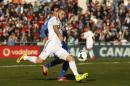 Real's Karim Benzema prepares to score his goal during a Spanish La Liga soccer match between Real Madrid and Getafe at the Coliseum Alfonso Perez stadium in Madrid, Spain, Sunday, Feb. 16, 2014. (AP Photo/Gabriel Pecot)