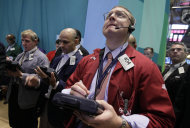 <p>               FILE - In this Friday, Aug. 3, 2012 file photo, trader Ryan Falvey, foreground right, works on the floor of the New York Stock Exchange. (AP Photo/Richard Drew, File)