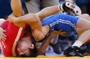 Kazakhstan's Akzhurek Tanatarov fights with Turkey's Ramazan Sahin for the bronze medal of the Men's 66Kg Freestyle wrestling at the ExCel venue during the London 2012 Olympic Games
