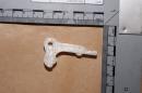 ADDS POLICE STATEMENT INDICATING DOUBTS - Undated handout photo made available by Greater Manchester Police in northern England Friday Oct. 25, 2013 of a component made with a 3D printer which was found by officers during a raid on suspected gang members in the Bagley area of Manchester. Police initially claimed the item was part of a plastic printed firearm but later Friday issued a statement that they "cannot categorically say" it was a gun. (AP Photo/Greater Manchester Police)