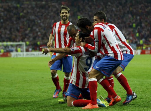 Atletico Madrid's Falcao celebrates with his teammates after scoring his second goal against Athletic Bilbao during their Europa League final soccer match at the National Arena in Bucharest