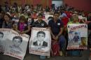 Relatives and friends of the 43 missing missing students wait before experts from the Inter-American Commission on Human Rights present the first conclusions of their investigation, in Mexico City on September 6, 2015