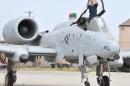 A US Air Force airman cleans the canopy of an A-10 Thunderbolt aircraft in Osan, South Korea on April 14, 2009