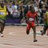 Jamaica's Usain Bolt, left, prepares to pass United States' Justin Gatlin, center,  and Jamaica's Yohan Blake, to win in the men's 100-meter final during the athletics in the Olympic Stadium at the 2012 Summer Olympics, London, Sunday, Aug. 5, 2012.(AP Photo/Kirsty Wigglesworth)