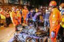 Rescue workers gather body bags following a bombing in Davao City in the southern Philippines on September 3, 2016