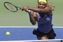 Serena Williams volleys against Jelena Jankovic, from Serbia, during a match at the Western & Southern Open tennis tournament, Friday, Aug. 15, 2014, in Mason, Ohio. (AP Photo/Al Behrman)