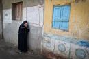 A relative of one of the Egyptian Coptic Christians purportedly murdered by Islamic State group militants in Libya reacts after hearing the news on February 16, 2015 in the village of Al-Awar