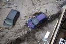 Partially-submerged cars are pictured during heavy flooding in the city of Varna