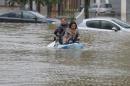Residents use a canoe to evacuate in downtown Nemours, 50 miles south of Paris, Thursday, June 2, 2016. Floods inundating parts of France and Germany have left five people reported dead and thousands trapped in homes or cars, as rivers have broken their banks from Paris to Bavaria. (AP Photo/Francois Mori)