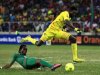 Togo's Adebayor is tackled by Burkina Faso's Kone during their African Cup of Nations quarter-final soccer match at the Mbombela Stadium in Nelspruit