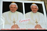 Portraits of the Pope outside a souvenir shop near the Vatican in Rome this week. The pope told members of the Roman Curia -- the government of the Church -- that the beauty of God's creation "is constantly contradicted by the evil of this world, by suffering and by corruption."