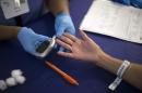 A person receives a test for diabetes during Care Harbor LA free medical clinic in Los Angeles
