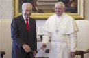 Pope Francis greets Israeli President Peres during a private meeting at the Vatican