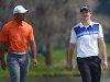 Tiger Woods, left, and Justin Rose, of England, walk to their next shot on the fairway during the second round of the Arnold Palmer Invitational golf tournament, Friday, March 22, 2013, in Orlando, Fla. (AP Photo/Phelan M. Ebenhack)