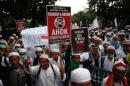 Indonesian Muslims attend a rally calling for the arrest of Jakarta's Governor Basuki Tjahaja Purnama, popularly known as Ahok, who is accused of insulting the Koran, in Jakarta