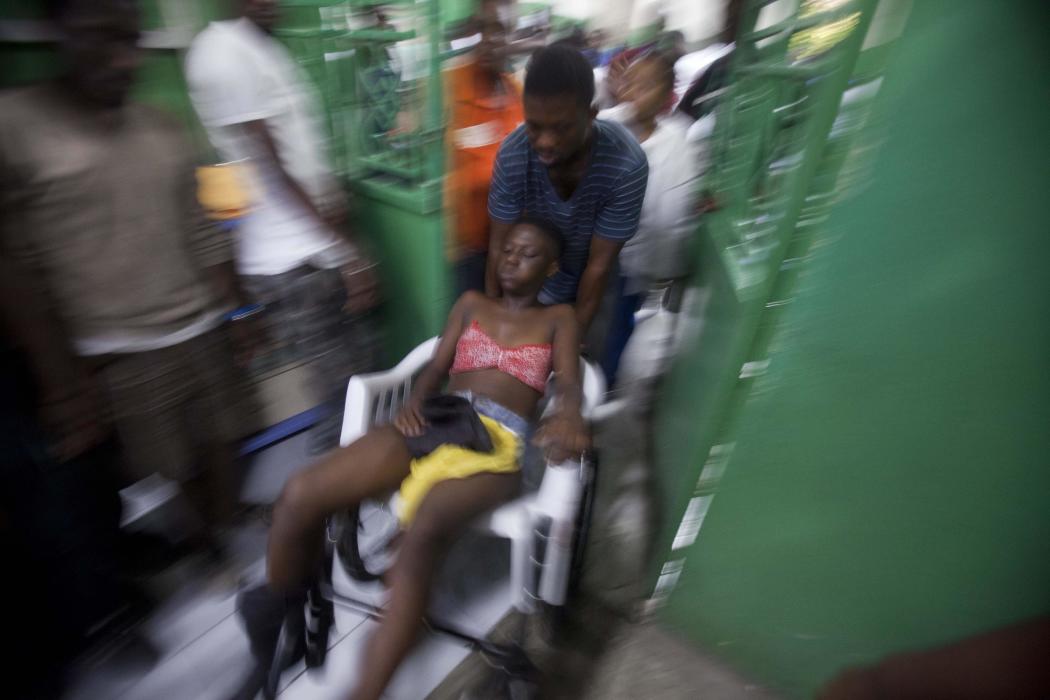 A reveler who was injured during carnival celebrations waits for treatment at the emergency room of the General Hospital in Port-au-Prince, Haiti...