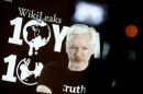Julian Assange, Founder and Editor-in-Chief of WikiLeaks speaks via video link during a press conference on the occasion of the ten year anniversary celebration of WikiLeaks in Berlin