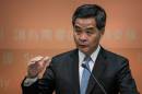 Chief Executive Leung Chun-ying gestures during a press conference after his 2014 policy address in Hong Kong on January 15, 2014