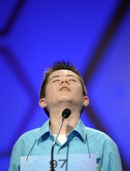 Caleb Miller, 13, of Calhoun, La., cast his head back after incorrectly spelling "cyanope'" during the semifinal round of the Scripps National Spelling Bee in Oxon Hill, Md., Thursday, May 30, 2013. (AP Photo/Cliff Owen)