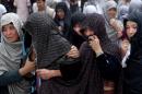 Afghan women mourn during the funeral of victims who died from a suicide attack, in Kabul, Afghanistan, Sunday, July 24, 2016. Afghanistan held a national day of mourning on Sunday, a day after a suicide bomber killed at least 80 people who were taking part in a peaceful demonstration in Kabul. The attack was claimed by the Islamic State group. (AP Photos/Massoud Hossaini)