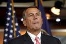 U.S. House Speaker Boehner reacts during a news conference on Capitol Hill in Washington