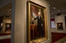 This photo taken Aug. 27, 2014 shows presidential portraits, including this painting of George Washington by artist Gilbert Stuart from 1796, center, at the National Portrait Gallery in Washington. One of the most famous portraits of George Washington will soon get a high-tech examination and face-lift of sorts with its first major conservation treatment in decades. The Smithsonian's National Portrait Gallery has begun planning the conservation and digital analysis of the full-length "Lansdowne" portrait of the first president that was painted by Gilbert Stuart in 1796, museum officials told The Associated Press. The 8-foot-by-5-foot picture is considered the definitive portrait of Washington as president after earlier images in military uniform. (AP Photo/Jacquelyn Martin)