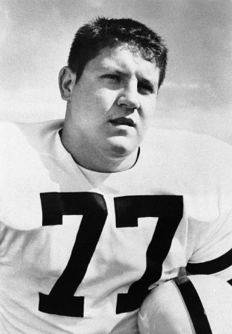 FILE - This 1956 file photo shows Iowa tackle Alex Karras. Karras, who gained fame in the NFL as a fearsome defensive lineman and later as an actor, has died. He was 77. Craig Mitnick, Karras' attorney, said Karras died at home in Los Angeles on Wednesday, Oct. 10, 2012, surrounded by family. (AP Photo, File)