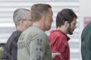 FILE- In this Jan. 9, 2017 file photo, Esteban Santiago, right, accused of fatally shooting several people and wounding multiple others at a crowded Florida airport baggage claim, is returned to Broward County's main jail after his first court appearance in Fort Lauderdale, Fla. Authorities say such walk-ins are a daily occurrence around the country. Assessing whether the people are reporting a credible threat or whether they need medical help is extremely difficult and drains already-stretched law enforcement resources. (AP Photo/Alan Diaz, File)