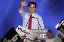 Wisconsin Republican Gov. Scott Walker waves at his victory party Tuesday, June 5, 2012, in Waukesha, Wis. Walker defeated Democratic challenger Tom Barrett in a special recall election. (AP Photo/Morry Gash)