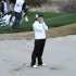 McIlroy reacts in sand trap on 18th against Lowry during first round of the WGC-Accenture Match Play golf in Marana