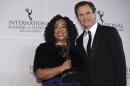 Shonda Rhimes, left, winner of the Founders Award and presenter Tony Goldwyn appear in the press room for the 44th International Emmy Awards at the New York Hilton on Monday, Nov. 21, 2016, in New York. (Photo by Charles Sykes/Invision/AP)