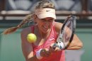 Victoria Azarenka of Belarus returns in her first round match against Alberta Brianti of Italy at the French Open tennis tournament in Roland Garros stadium in Paris, Monday May 28, 2012. (AP Photo/David Vincent)