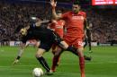 Liverpool's German midfielder Emre Can (R) vies for the ball with Rubin Kazan's Bulgarian midfielder Blagoy Georgiev (L) during a UEFA Europa League group B football match in Liverpool, England, on October 22, 2015