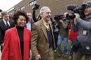 Senate Minority Leader Mitch McConnell, R-Ky., with his wife, former Labor Secretary Elaine Chao, smiles after casting his ballot in the midterm election at the voting precinct at Bellarmine University in Louisville, Ky., Tuesday, Nov. 4, 2014. McConnell won a sixth term in Washington, with his eyes on the larger prize of GOP control of the Senate. The Kentucky U.S. Senate race, with McConnell, a 30-year incumbent facing a spirited challenge from Democrat Alison Lundergan Grimes, has been among the most combative and closely watched contests that could shift the balance of power in Congress. (AP Photo/J. Scott Applewhite)