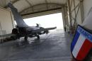 French soldiers prepare a Rafale fighter jet at a military base at an undisclosed location in the Gulf on November 17, 2015, as the French army conducts operations against the Islamic State group in Syria and Iraq