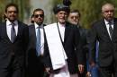 Afghan president-elect Ashraf Ghani (C) arrives for his swearing in ceremony as the country's new president at the Presidential Palace in Kabul on September 29, 2014