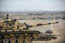 Turkish army tanks take position near the Syrian border