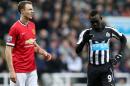 Manchester United's Jonny Evans (L) reacts next to Newcastle United's Papiss Cisse during their English Premier League football match in Newcastle-Upon-Tyne, England, March 4, 2015