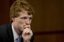 FILE - In this Sept. 19, 2013 file photo, U.S. Rep. Joe Kennedy, D-Mass., looks to committee members during the Senate Foreign Relations Committee nomination hearing on Capitol Hill in Washington, on his cousin, Caroline Kennedy, to be Ambassador to Japan. In an interview with The Associated Press, U.S. Rep. Joe Kennedy, D-Mass., discusses his first year in office. (AP Photo/Carolyn Kaster, File)