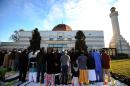 Muslim devotees take part in a special morning prayer to mark the start of Eid al-Adha festival at mosque in Silver Spring, Maryland, on November 6, 2011