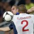 France's Ribery and England's Johnson fight for the ball during their Group D Euro 2012 soccer match in Donetsk