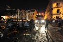 A fire engine arrives at the scene of explosions near judicial buildings in Benghazi
