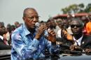 Guinea's President and presidential candidate Alpha Conde speaks at a rally reiterating his call for calm in Conakry on October 9, 2015