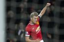 Manchester United's James Wilson celebrates after scoring during the English FA Cup fourth-round replay soccer match between Manchester United and Cambridge at Old Trafford Stadium, Manchester, England, Tuesday Feb. 3, 2015. (AP Photo/Jon Super)