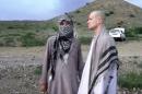 In this image taken from video obtained from Voice Of Jihad Website, which has been authenticated based on its contents and other AP reporting, Sgt. Bowe Bergdahl, right, stands with a Taliban fighter in eastern Afghanistan. The Taliban on Wednesday, June 4, 2014, released a video showing the handover of Bergdahl to U.S. forces in eastern Afghanistan, touting the swap of the American soldier for five Taliban detainees from Guantanamo as a significant achievement for the insurgents. Bergdahl was freed on Saturday after five years in captivity, and exchanged for the five Guantanamo detainees who were flown to Qatar, a tiny Gulf Arab country which has served as a mediator in the negotiations for the swap. (AP Photo/Voice Of Jihad Website via AP video)