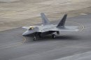 In this Aug. 14, 2012 photo, a U.S. Air Force F-22 Raptor stealth fighter taxis before take-off at Kadena Air Base on the southern island of Okinawa in Japan. The U.S. is hoping a dozen F-22 stealth fighters now roaring through the skies of southern Japan will prove its most prized combat aircraft is finally ready to resume full operations after years of investigations into why its pilots were getting dizzy and disoriented. But questions remain over whether the Air Force has taken enough action to fix a potentially bigger problem - the shriveling of programs to test cockpit life support systems after nearly 20 years of budget cuts, downsizing and outsourcing. (AP Photo/Greg Baker)